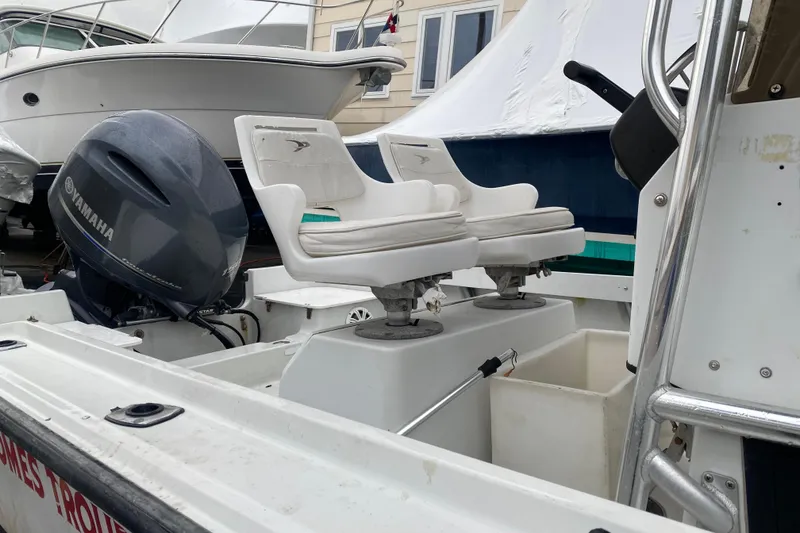Slide: The Image of 1994 Boston Whaler 19 Outrage boat interior with Yamaha engine and dual seats. - 7