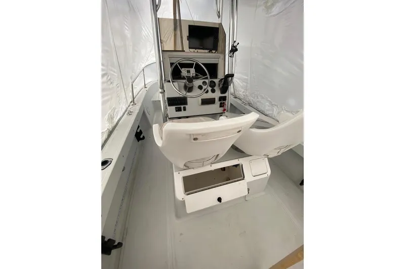 Slide: The Image of 1994 Boston Whaler 19 OUTRAGE boat interior with steering console and seating. - 9