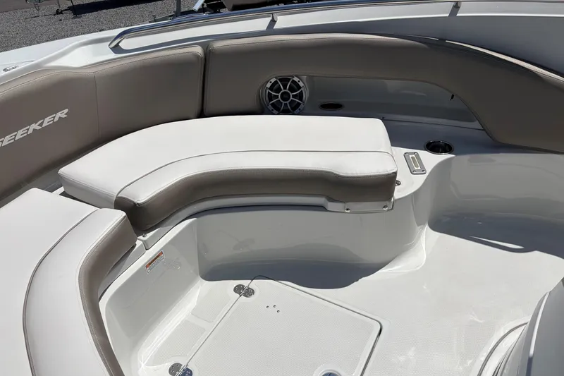 Slide: The Image of 2026 Crownline 210 CC Finseeker boat interior with cushioned seating and cup holders. - 14