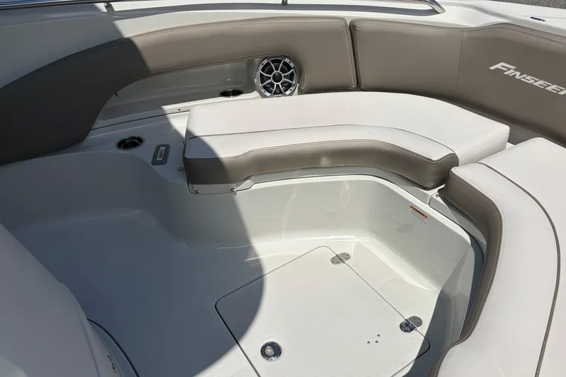Slide: The Image of Interior of 2026 Crownline 210 CC Finseeker boat with cushioned seating and speaker. - 15