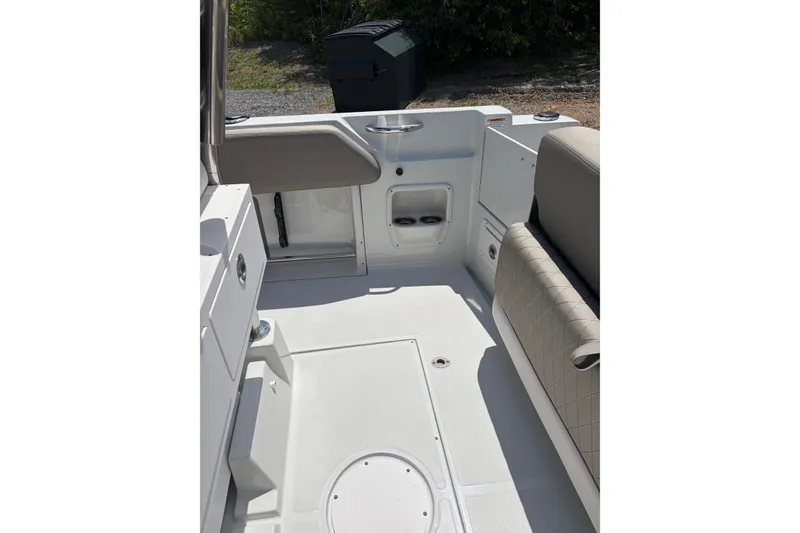 Slide: The Image of Interior of 2026 Crownline 210 CC Finseeker boat, featuring seating and storage compartments. - 5
