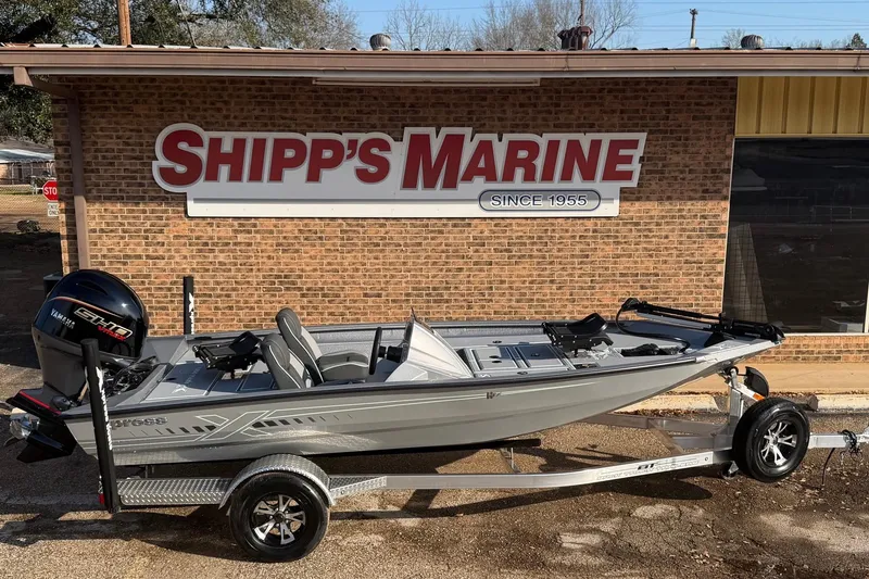 The Image of 2026 Xpress H17C Crappie boat on trailer at Shipp's Marine dealership. - 1