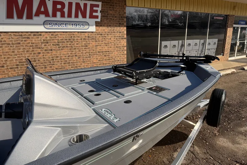 Slide: The Image of 2026 Xpress H17C Crappie boat displayed outside a marine store. - 4
