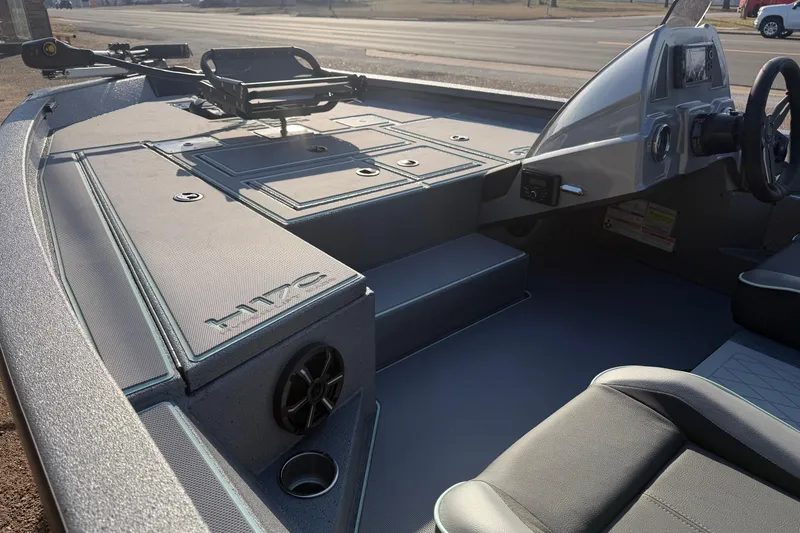 Slide: The Image of 2026 Xpress H17C Crappie boat interior with modern dashboard and seating. - 6