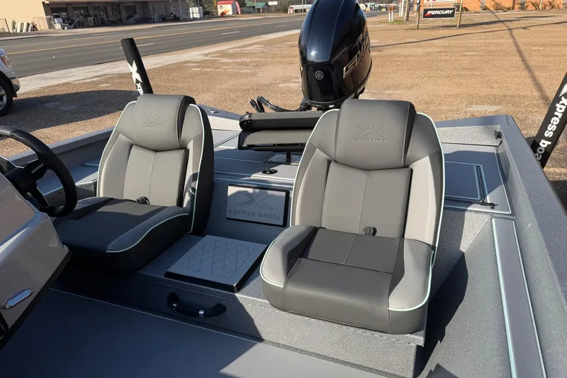 Slide: The Image of 2026 Xpress H17C Crappie boat interior with dual seats and Yamaha motor. - 7