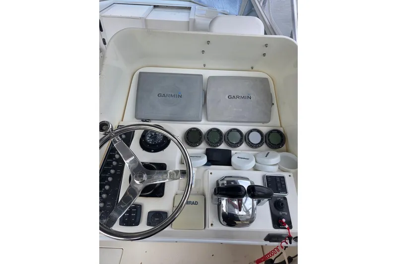 Slide: The Image of Console of 2008 Contender 35 Express Side Console with Garmin displays and controls. - 4