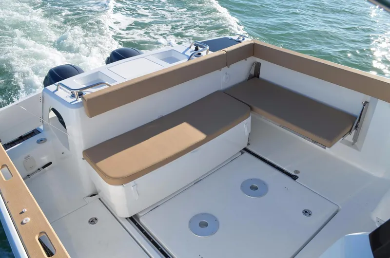 Slide: The Image of Manufacturer Provided Image: 2017 Jeanneau Merry Fisher 855 Marlin boat deck with seating and storage. - 14