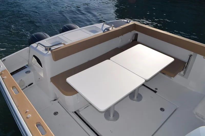 Slide: The Image of Manufacturer Provided Image: 2017 Jeanneau Merry Fisher 855 Marlin boat deck with seating and tables. - 15