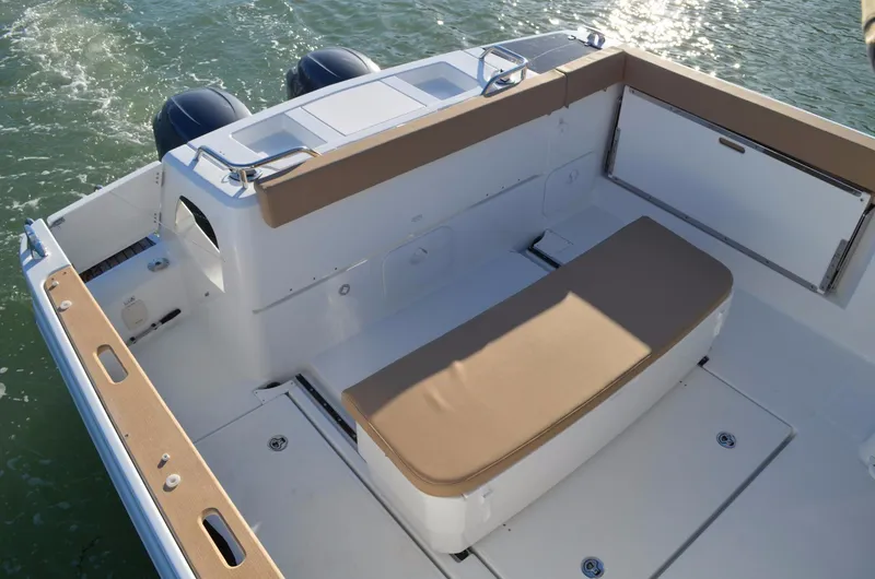 Slide: The Image of Manufacturer Provided Image: 2017 Jeanneau Merry Fisher 855 Marlin boat deck with seating and twin outboard motors. - 17