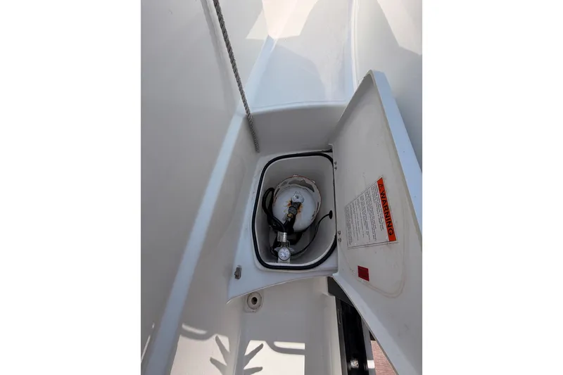 Slide: The Image of Storage compartment on 2017 Jeanneau Merry Fisher 855 Marlin boat, featuring a gas cylinder. - 21