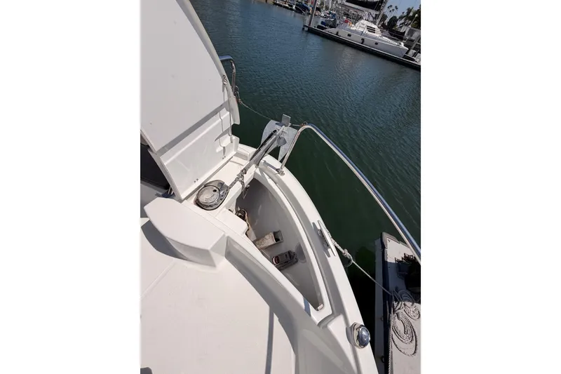 Slide: The Image of 2017 Jeanneau Merry Fisher 855 Marlin bow with anchor, docked in marina. - 25