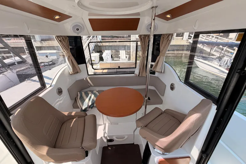 Slide: The Image of Interior of 2017 Jeanneau Merry Fisher 855 Marlin with seating and round table. - 30
