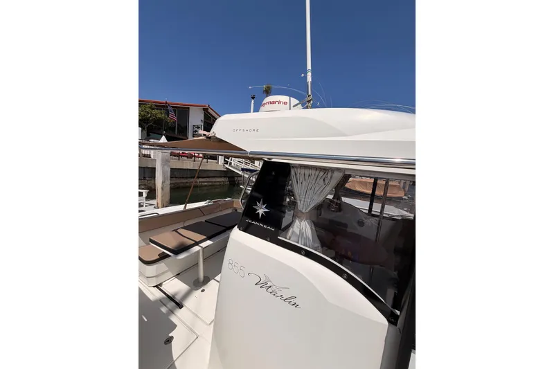 Slide: The Image of 2017 Jeanneau Merry Fisher 855 Marlin boat docked under clear blue sky. - 4