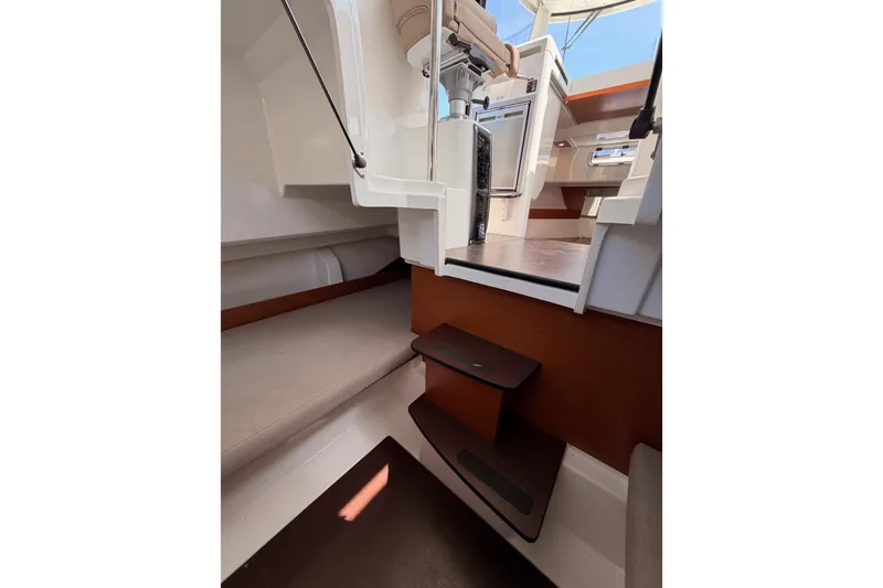 Slide: The Image of Interior view of 2017 Jeanneau Merry Fisher 855 Marlin boat cabin with steps and seating. - 40