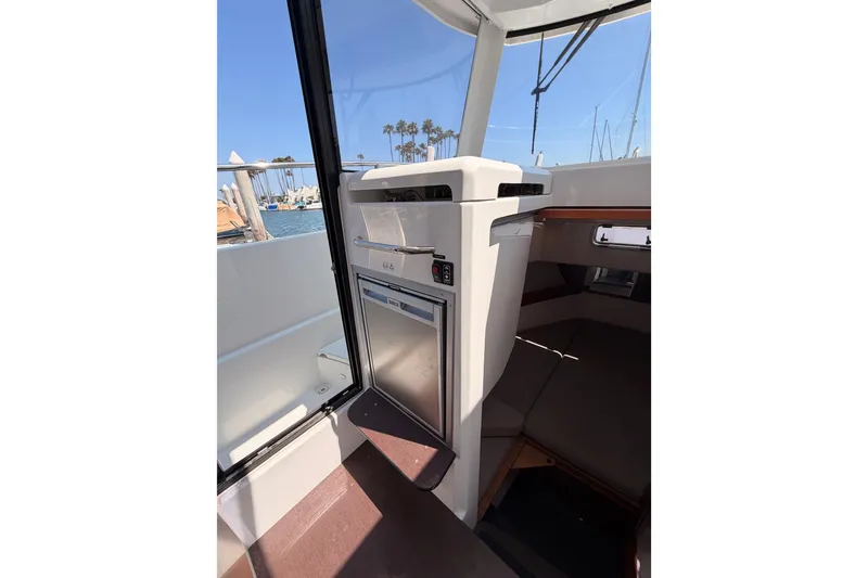 Slide: The Image of Interior view of 2017 Jeanneau Merry Fisher 855 Marlin boat, featuring a compact cabin area. - 42