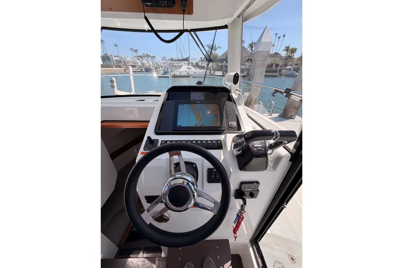Slide: The Image of Cockpit view of 2017 Jeanneau Merry Fisher 855 Marlin with navigation system. - 46