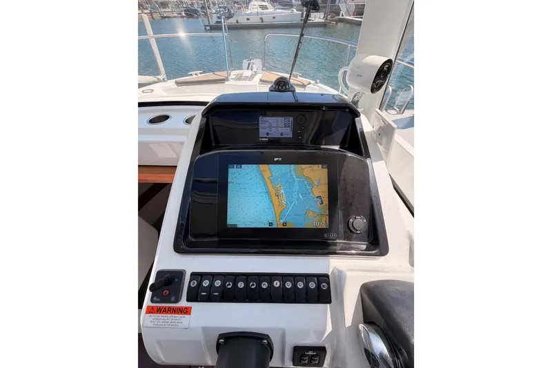 Slide: The Image of Cockpit view of 2017 Jeanneau Merry Fisher 855 Marlin with navigation display. - 48
