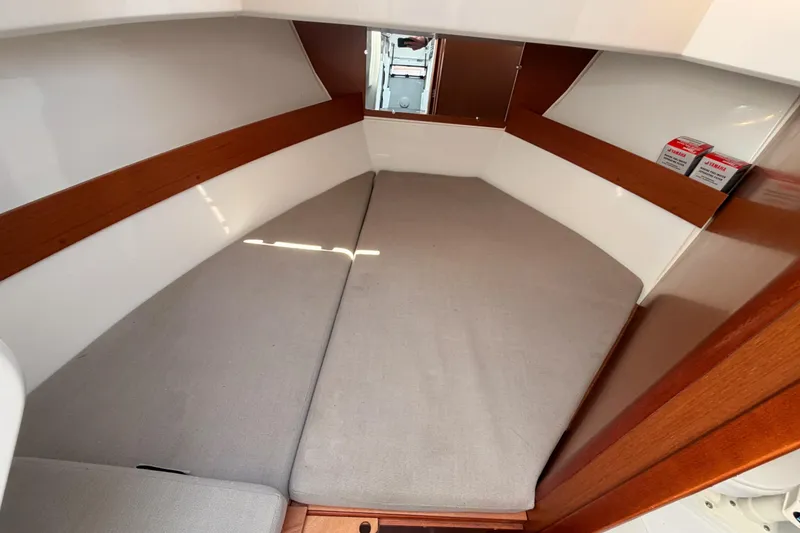 Slide: The Image of Cozy cabin interior of 2017 Jeanneau Merry Fisher 855 Marlin with cushioned seating. - 55