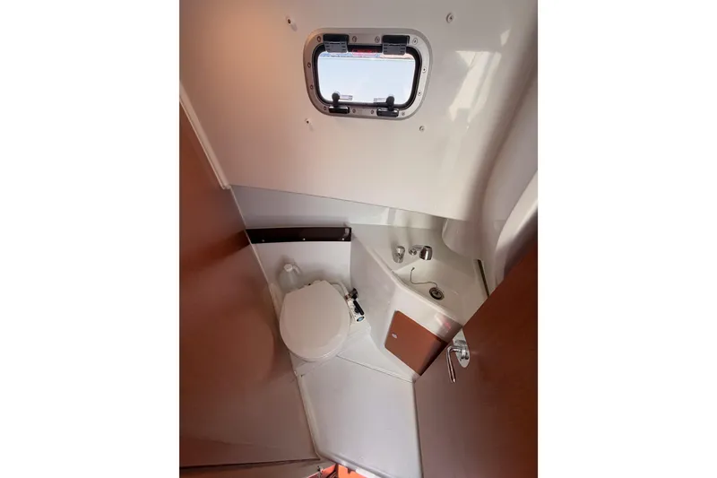 Slide: The Image of 2017 Jeanneau Merry Fisher 855 Marlin boat bathroom with toilet and sink. - 57