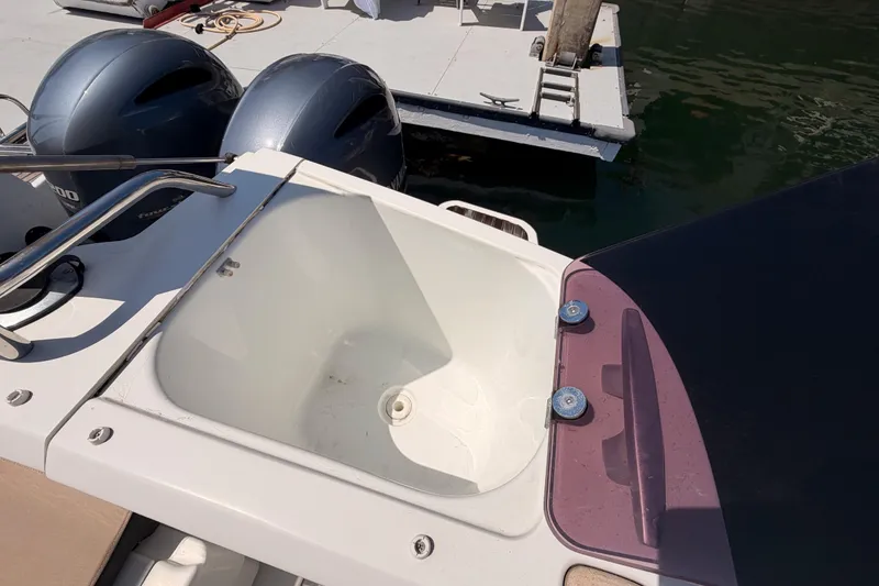 Slide: The Image of 2017 Jeanneau Merry Fisher 855 Marlin boat with dual outboard motors and deck sink. - 61
