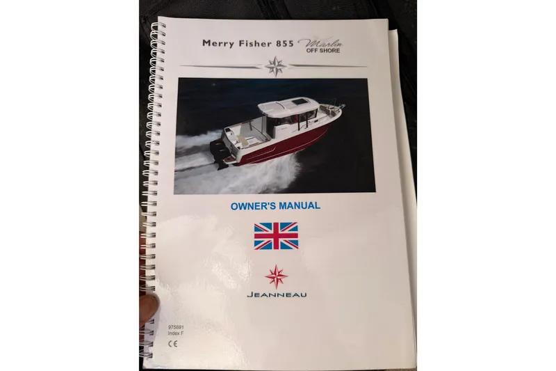 Slide: The Image of Owner's manual for 2017 Jeanneau Merry Fisher 855 Marlin boat, spiral-bound cover. - 65