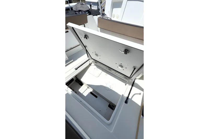 Slide: The Image of Open storage compartment on 2017 Jeanneau Merry Fisher 855 Marlin boat. - 66