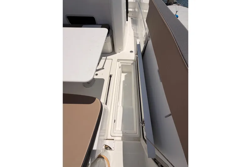 Slide: The Image of 2017 Jeanneau Merry Fisher 855 Marlin interior seating and storage area. - 67