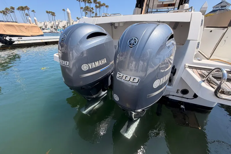 Slide: The Image of Twin Yamaha 200 outboard engines on a 2017 Jeanneau Merry Fisher 855 Marlin boat. - 7