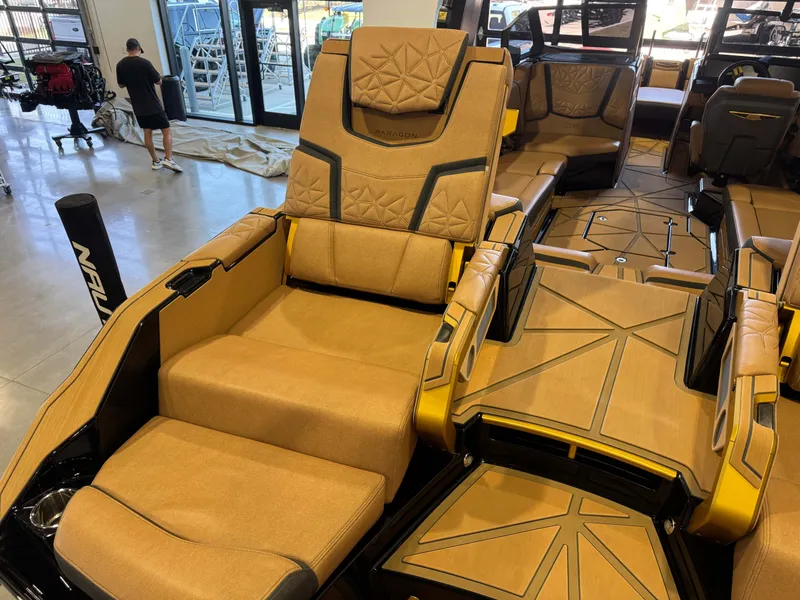 Slide: The Image of Interior of 2025 Nautique Super Air Nautique G25 Paragon with luxurious seating. - 13