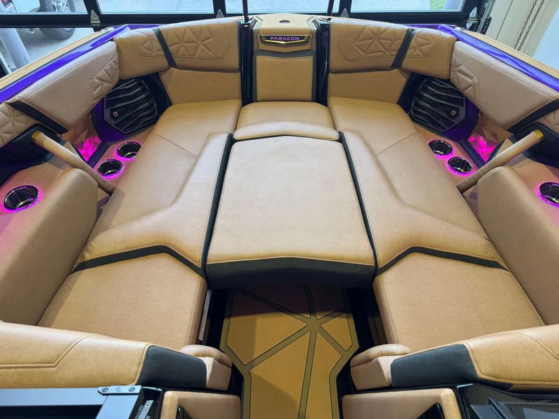 Slide: The Image of 2025 Nautique Super Air Nautique G25 Paragon interior with luxurious seating. - 19