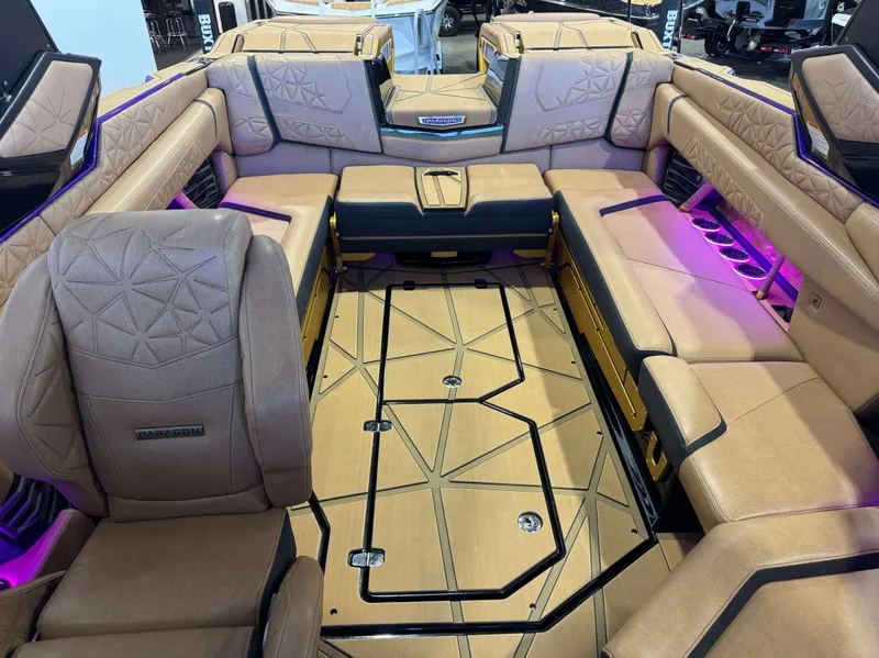 Slide: The Image of Interior of 2025 Nautique Super Air Nautique G25 Paragon with luxurious seating. - 24