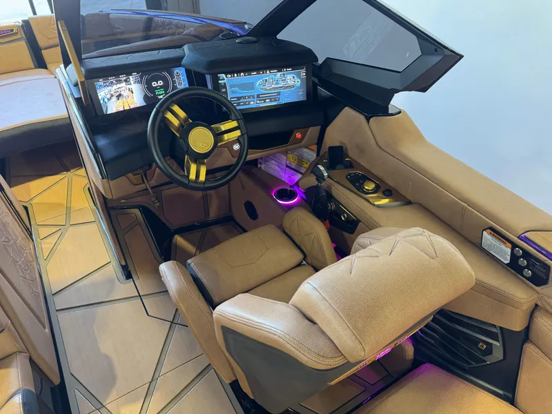 Slide: The Image of 2025 Nautique Super Air Nautique G25 Paragon interior with modern cockpit. - 27