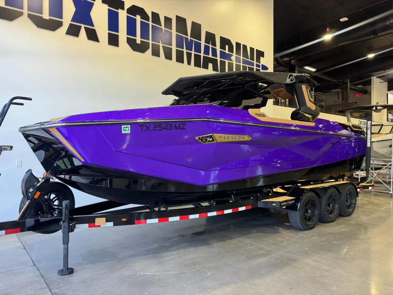 Slide: The Image of 2025 Nautique Super Air Nautique G25 Paragon in purple on trailer. - 3