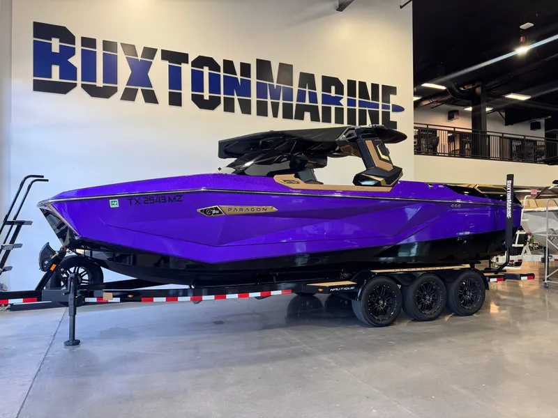 Slide: The Image of Purple 2025 Nautique Super Air Nautique G25 Paragon in showroom. - 4