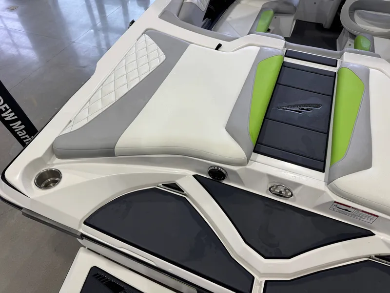 Slide: The Image of 2014 Tigé Z1 boat interior with green and gray upholstery. - 11