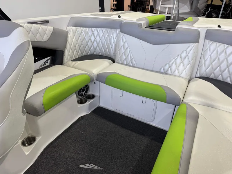 Slide: The Image of Interior of 2014 Tigé Z1 boat with green and white seating. - 14