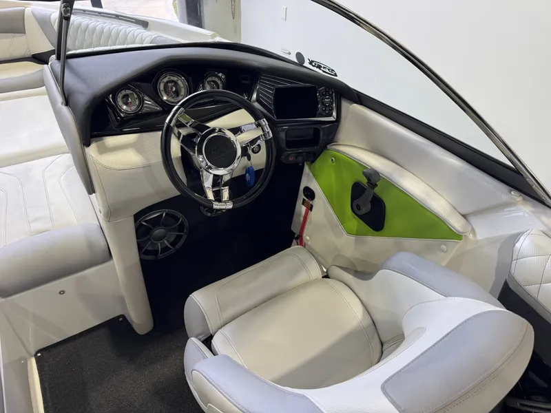 Slide: The Image of Interior of a 2014 Tigé Z1 boat with modern dashboard. - 23