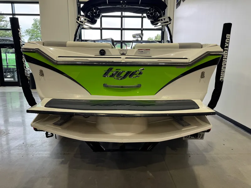Slide: The Image of Rear view of a 2014 Tigé Z1 boat in a garage. - 5