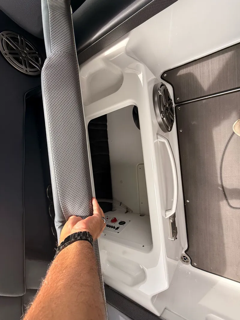 Slide: The Image of Interior of 2026 Scarab 285 LX with storage and speaker. - 26
