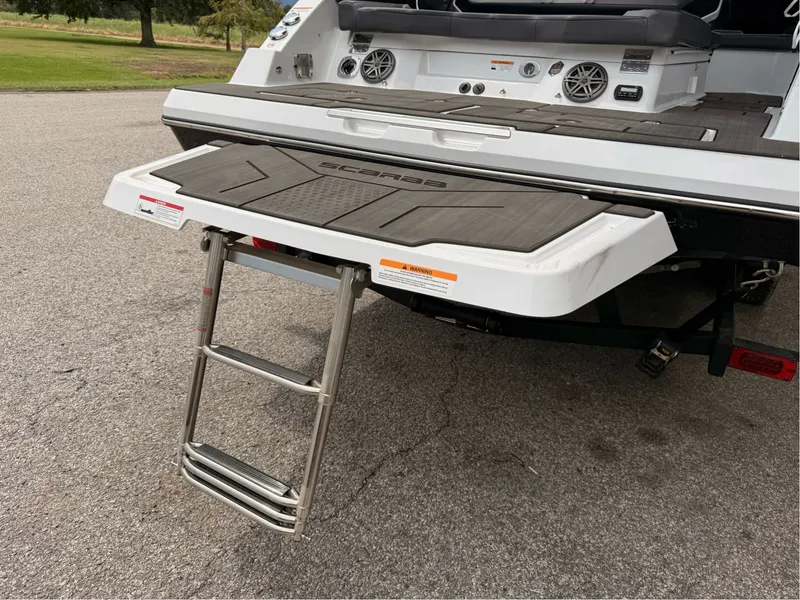 Slide: The Image of Scarab 285 LX 2026 with retractable swim ladder. - 31