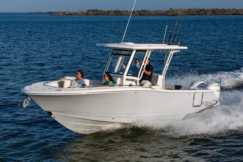 The Image of Manufacturer Provided Image: 2025 Robalo R270 Center Console boat cruising on open water with passengers. - 0