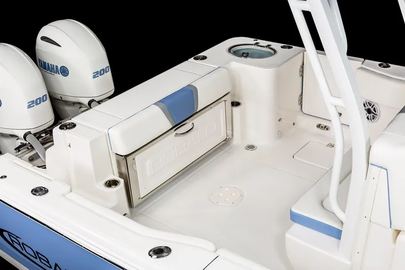 Slide: The Image of Manufacturer Provided Image: 2025 Robalo R270 Center Console boat interior with Yamaha engines, featuring seating and storage. - 10