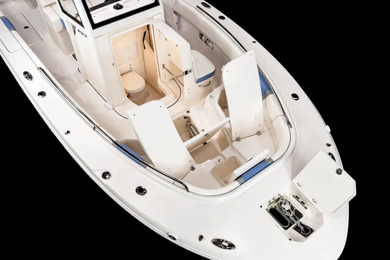 Slide: The Image of Manufacturer Provided Image: 2025 Robalo R270 Center Console boat interior with seating and storage compartments. - 4