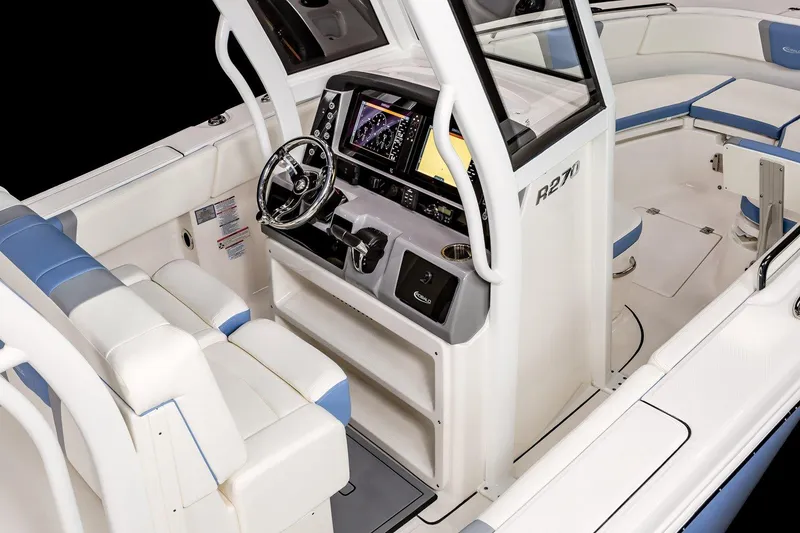 Slide: The Image of Manufacturer Provided Image: 2025 Robalo R270 Center Console boat interior with modern helm and seating. - 6