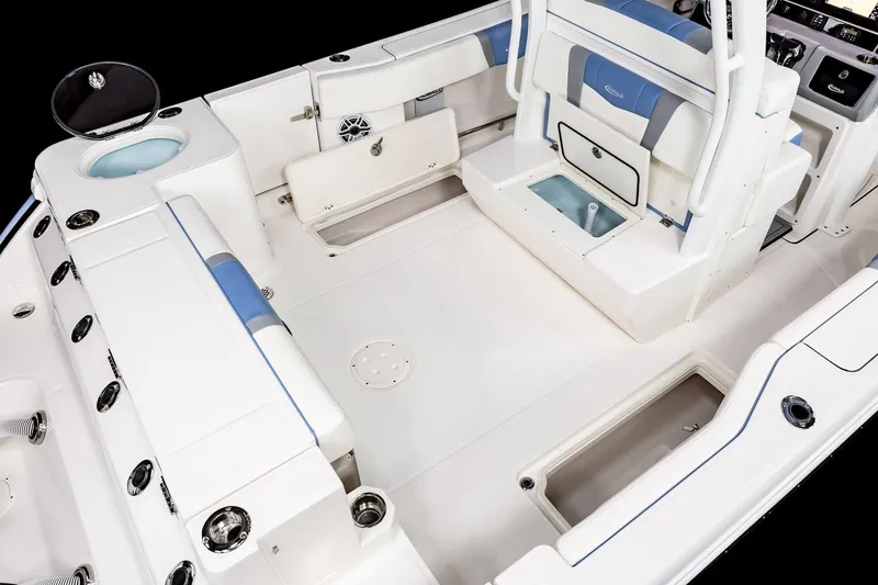 Slide: The Image of Manufacturer Provided Image: 2025 Robalo R270 Center Console boat interior with seating and storage compartments. - 9