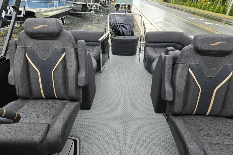 Slide: The Image of Interior of 2026 Evotti 721QL boat with sleek, rain-dappled seating and modern design. - 11