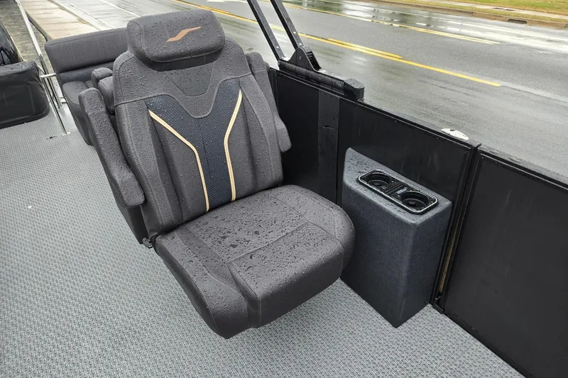 Slide: The Image of Luxurious Evotti 721QL boat seat with cup holders, featuring sleek design and rain droplets. - 12