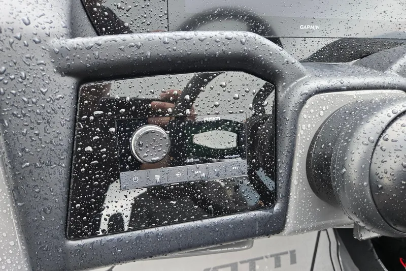 Slide: The Image of Raindrops on Evotti 721QL dashboard with control panel and Garmin display, 2026 model. - 16