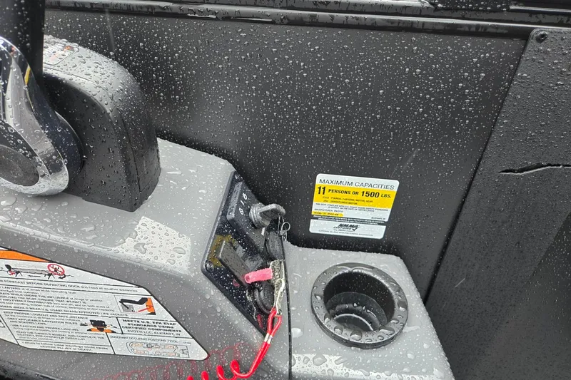 Slide: The Image of Control panel of Evotti 721QL boat, 2026 model, with capacity label and raindrops. - 19