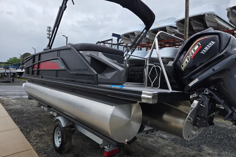 Slide: The Image of 2026 Evotti 721QL pontoon boat with Yamaha engine, parked on a trailer. - 2